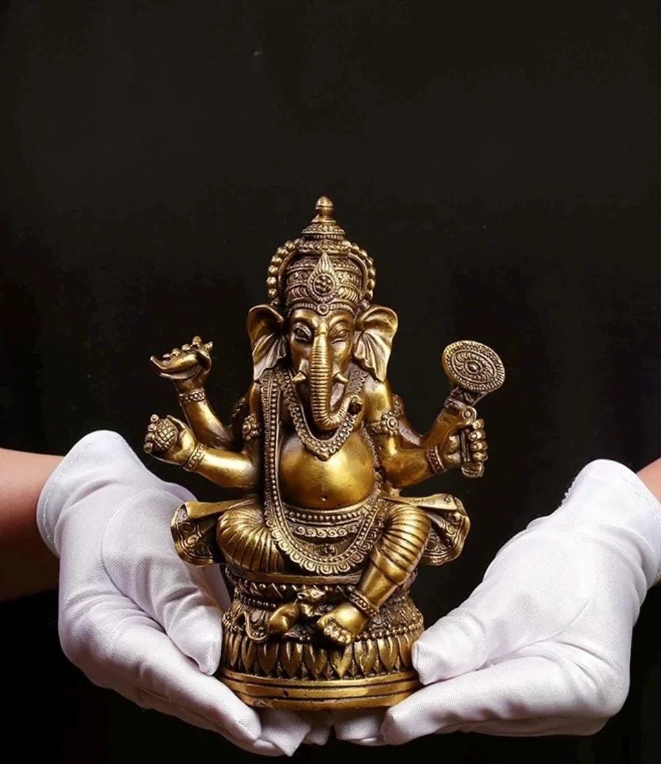 Brass Ganesha statue photographed view 1