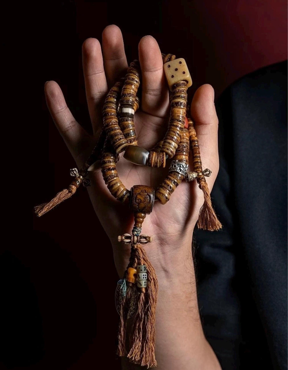 DECORATED MALA BEADS — original source view 1; ORIGINAL WEARING / HANDHELD PHOTOGRAPH