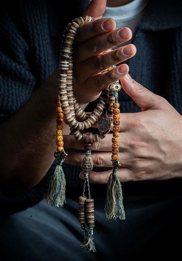 DECORATED MALA BEADS — original source view 1; ORIGINAL WEARING / HANDHELD PHOTOGRAPH