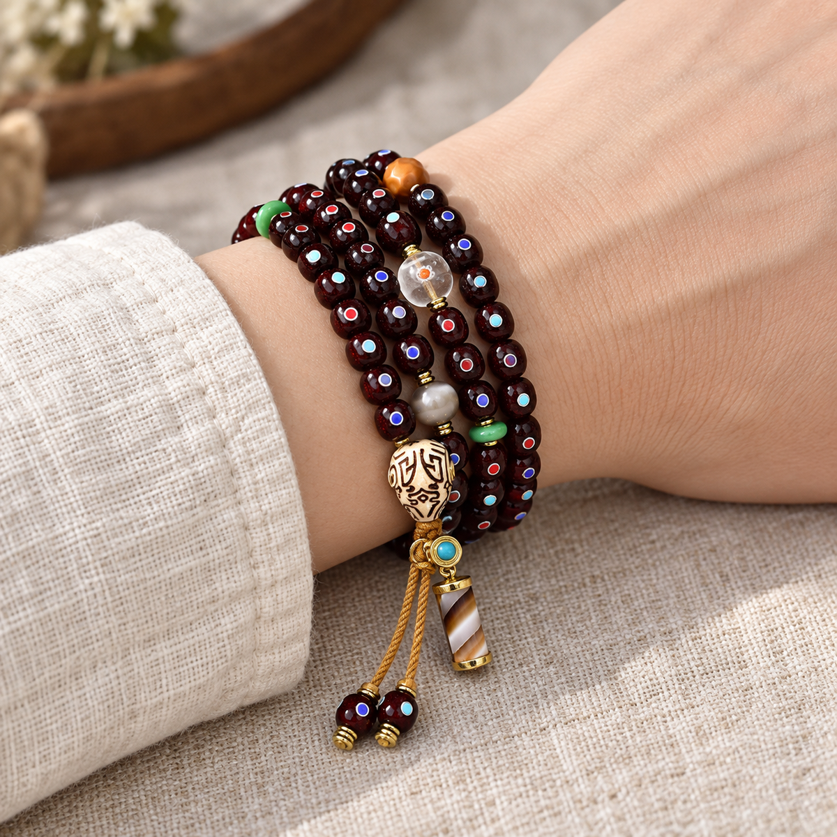 EverestArtstudios Natural Cinnabar-Finished Inlaid Xingyue Bodhi 108-Bead Mala — wrist resting