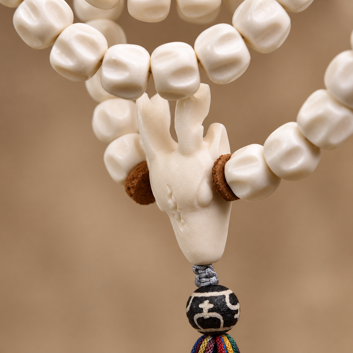 EverestArtstudios Natural Antler and Passion Seed 108-Bead Tibetan Mala Necklace — guru detail