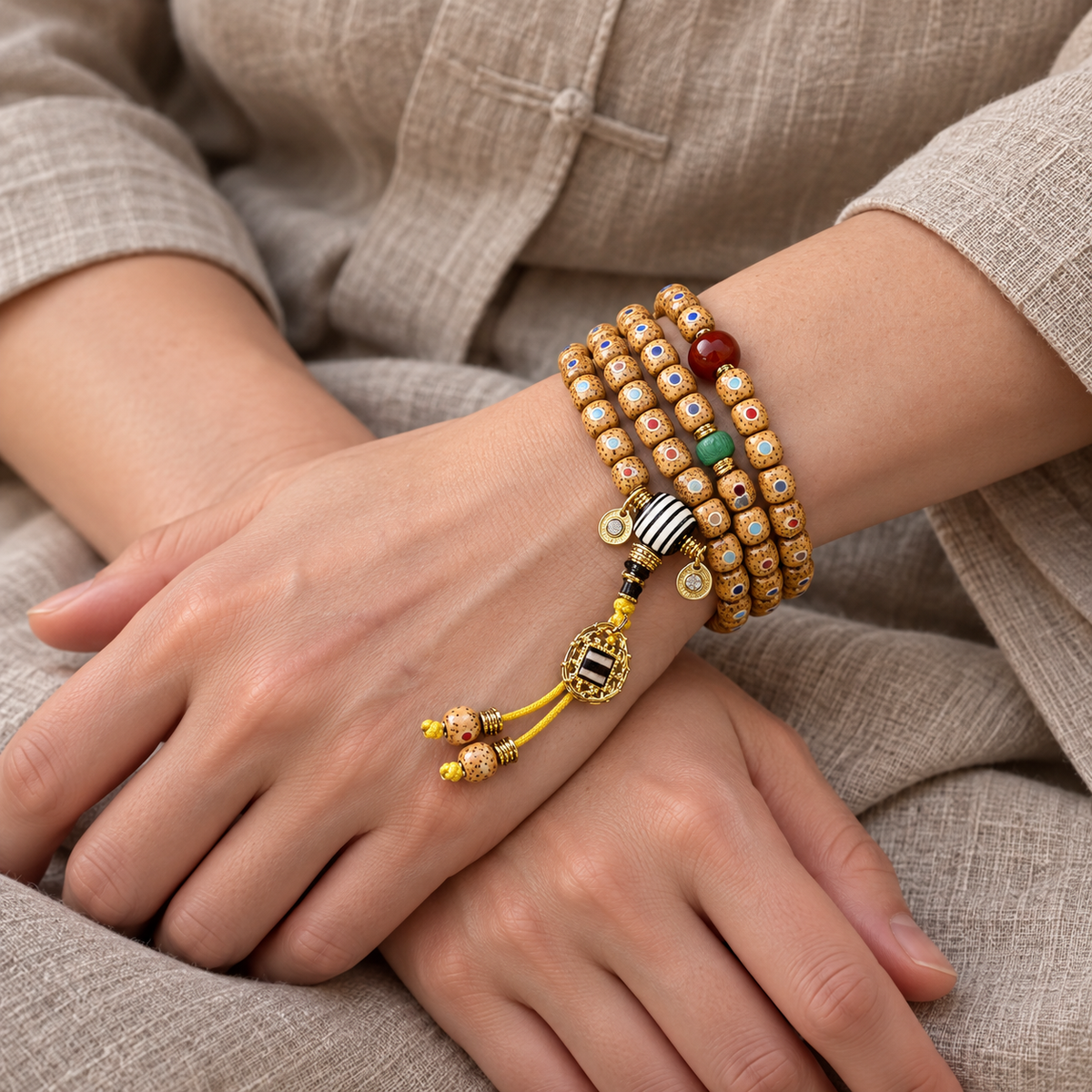 Inlaid Xingyue Bodhi Tibetan mala — wrist crossed