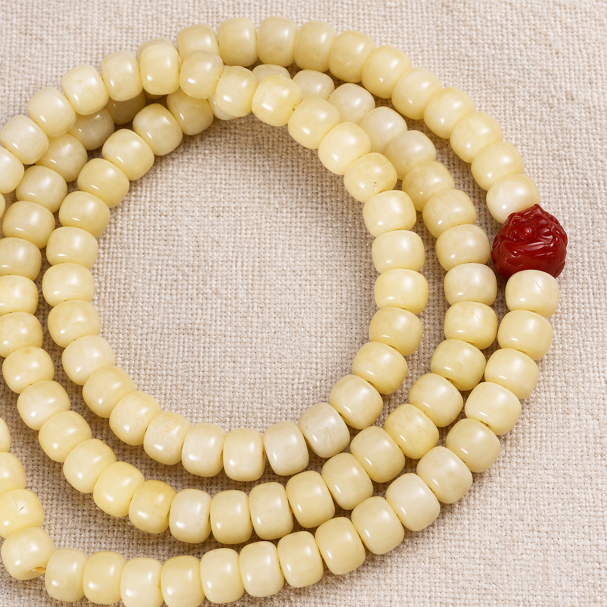 Golden white camel bone Tibetan mala — bead detail