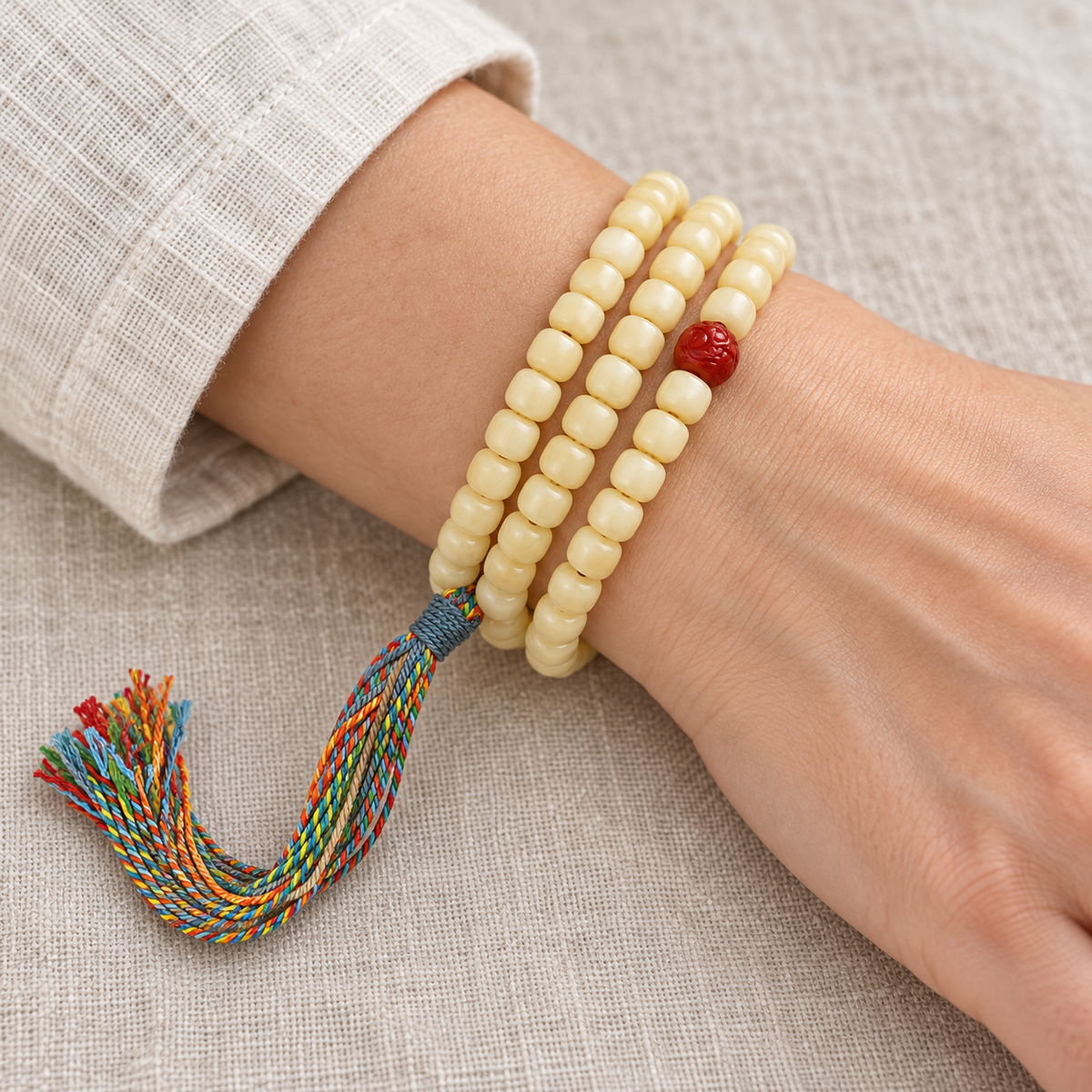 Golden white camel bone Tibetan mala — wrist resting