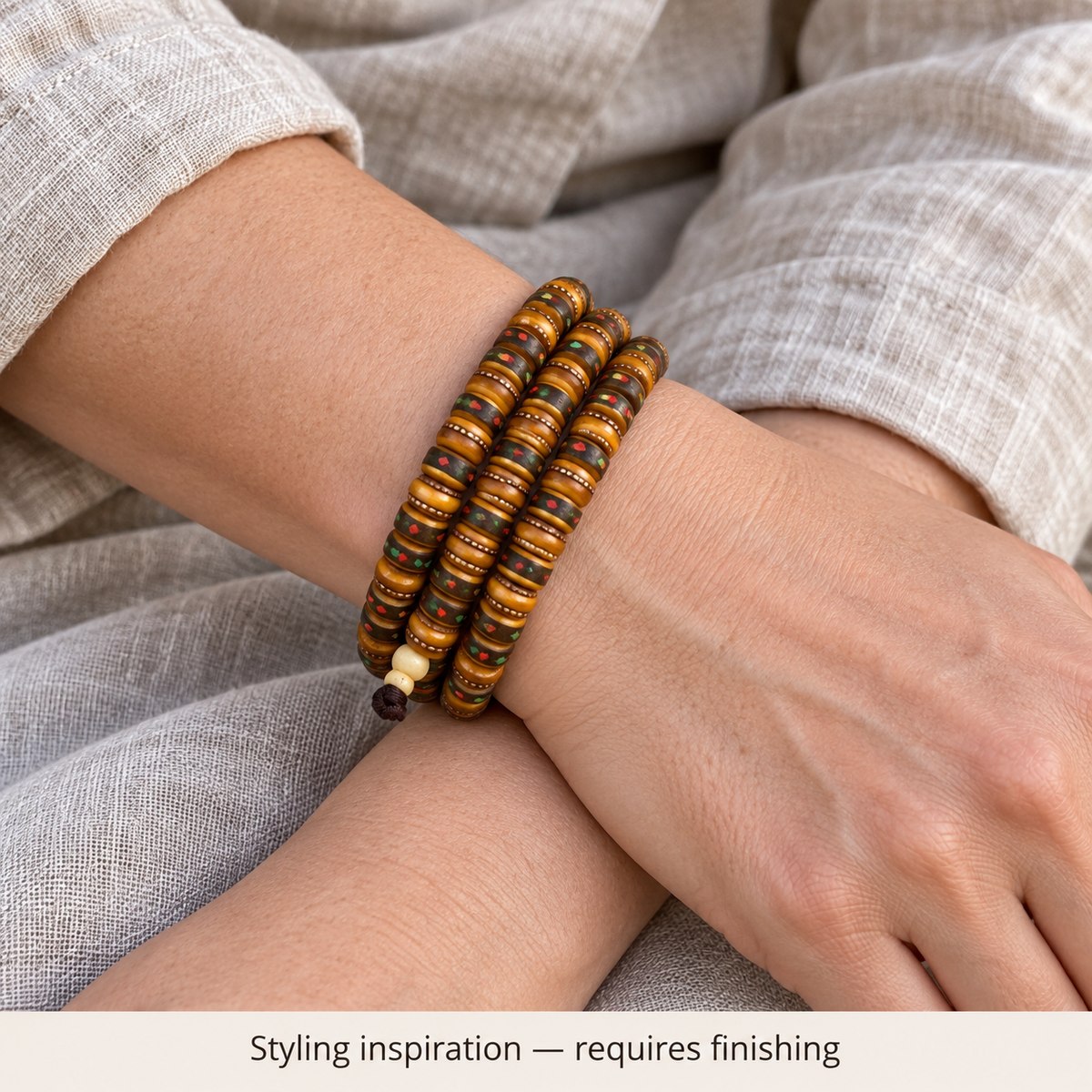 Tibetan mala DIY bead strand — wrist crossed