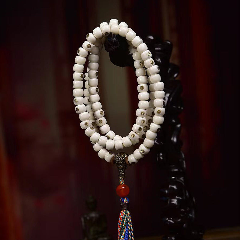 EverestArtstudios Natural Yak Bone Antique Copper Auspicious Wan 108-Bead Mala — display detail