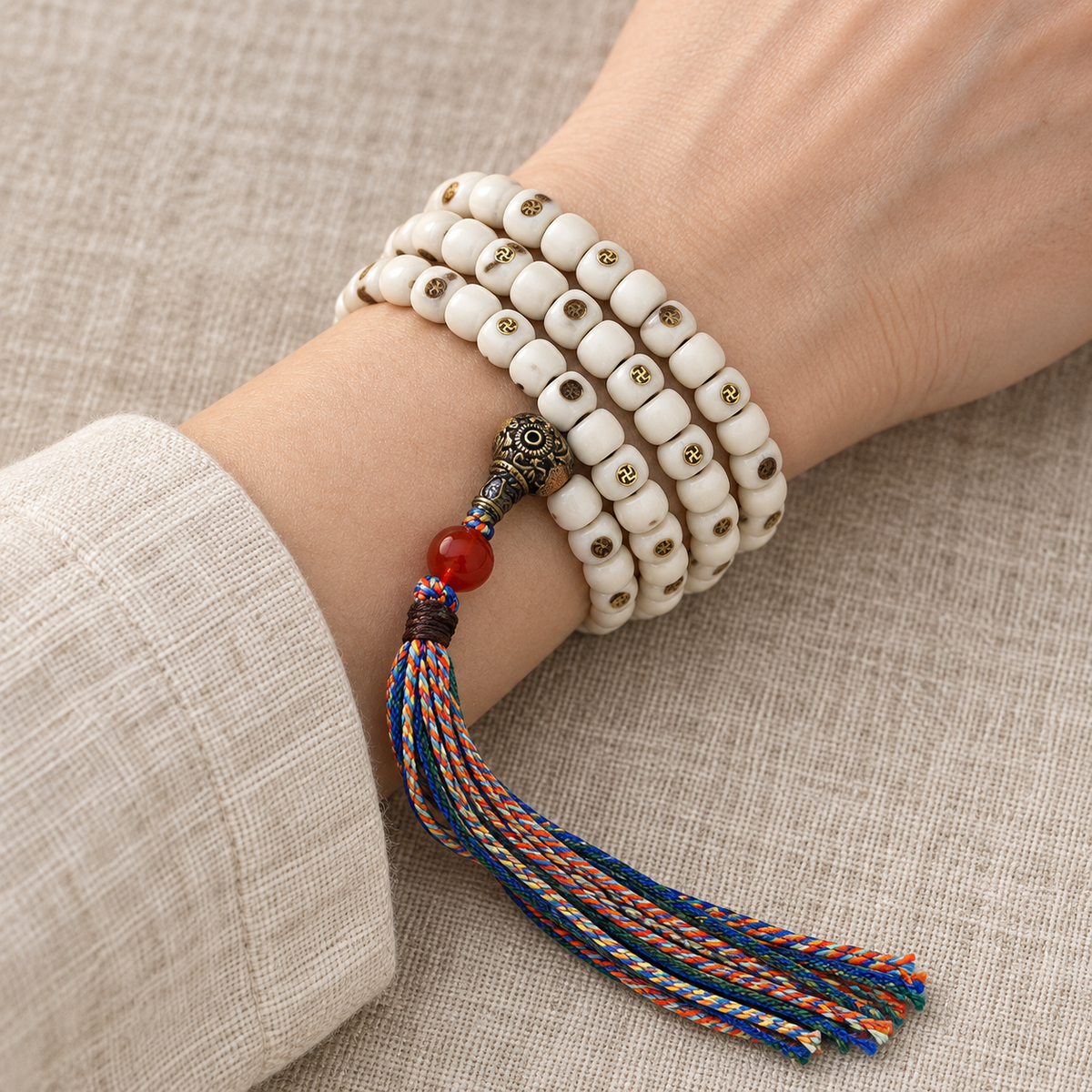 EverestArtstudios Natural Yak Bone Antique Copper Auspicious Wan 108-Bead Mala — wrist resting