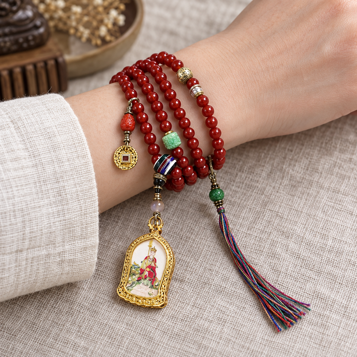 EverestArtstudios Red Agate 108-Bead Mala with Ksitigarbha Pendant — wrist resting
