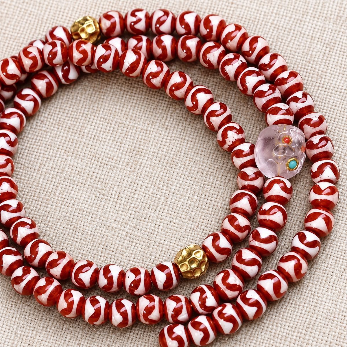 Tiger-Tooth Dzi and Amethyst Mala — bead detail