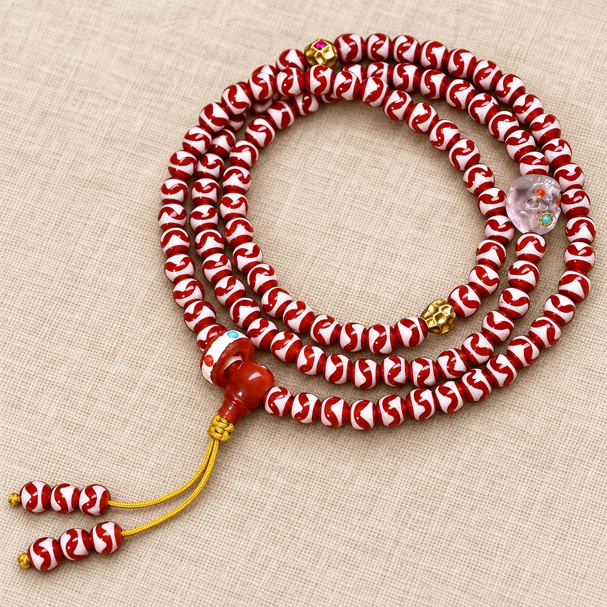 Tiger-Tooth Dzi and Amethyst Mala — accent detail