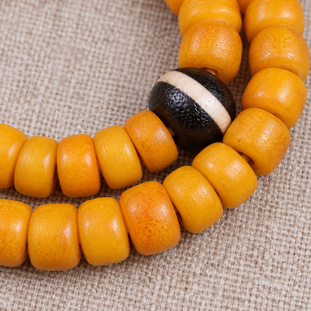 Golden-yellow camel bone 108-bead mala — bead detail