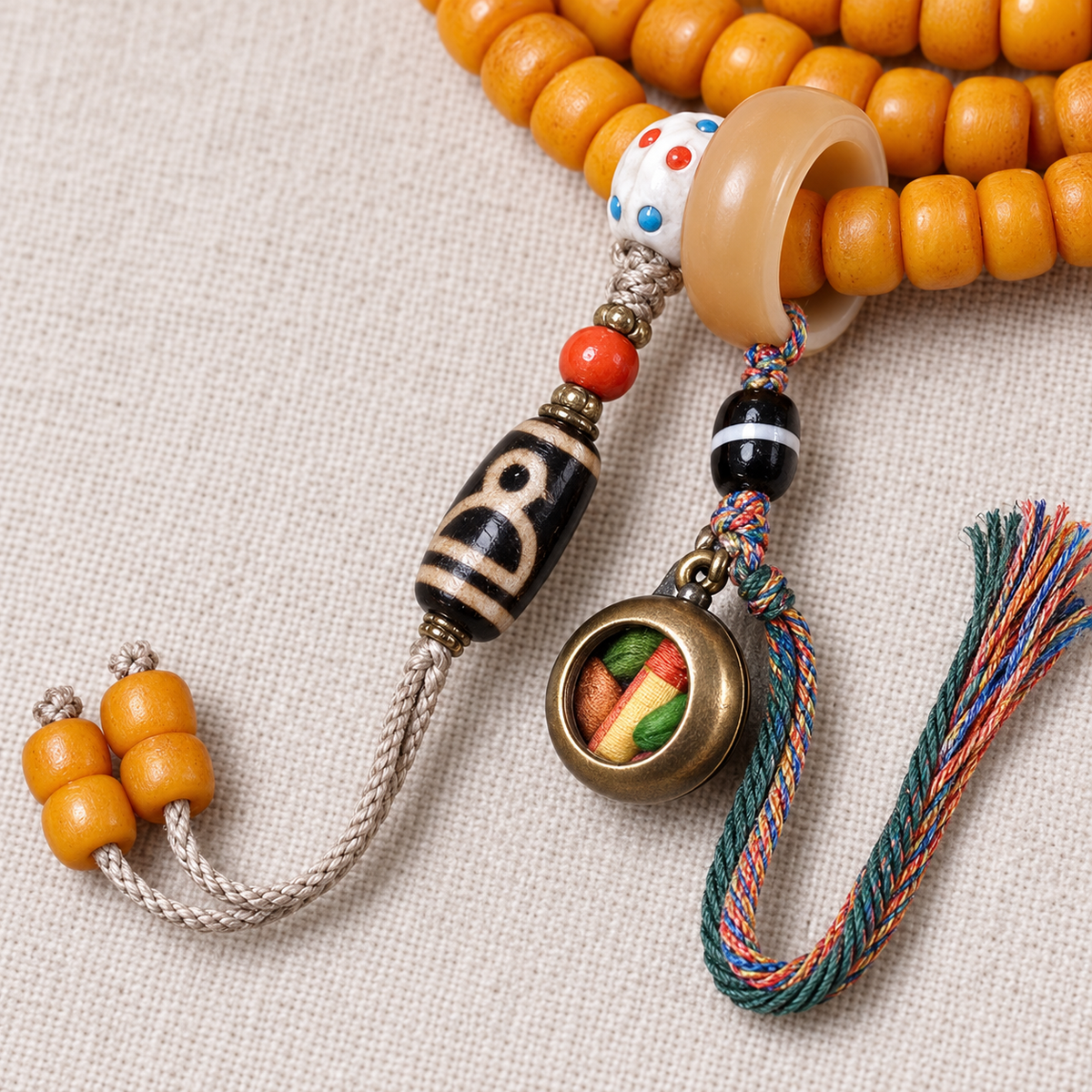 Golden-yellow camel bone 108-bead mala — pendant detail