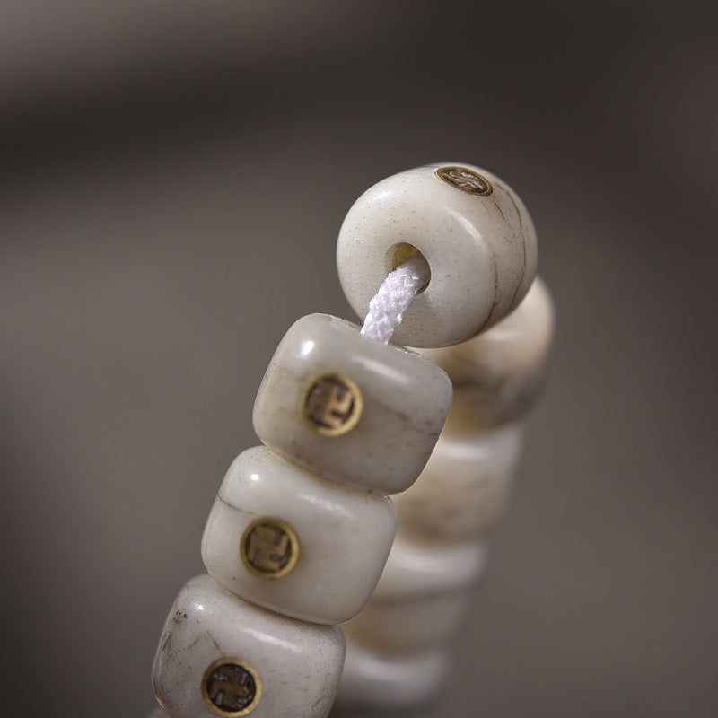 EverestArtstudios Aged Camel Bone Antique Copper Auspicious Wan 108-Bead DIY Strand — connection detail