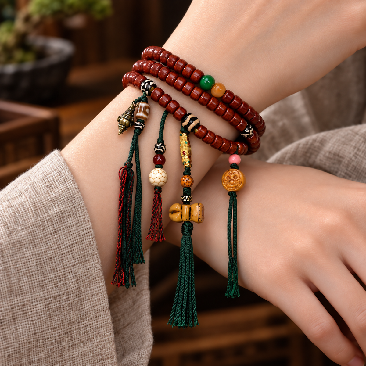 EverestArtstudios Tibetan Yak Bone Barrel-Bead 108-Bead Mala with Copper Clip — wrist crossed