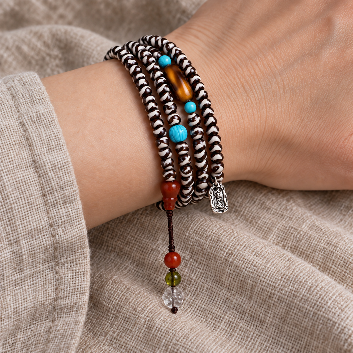 EverestArtstudios Natural Agate Tiger-Tooth Dzi 108-Bead Mala with Red Agate and Clear Quartz — wrist resting