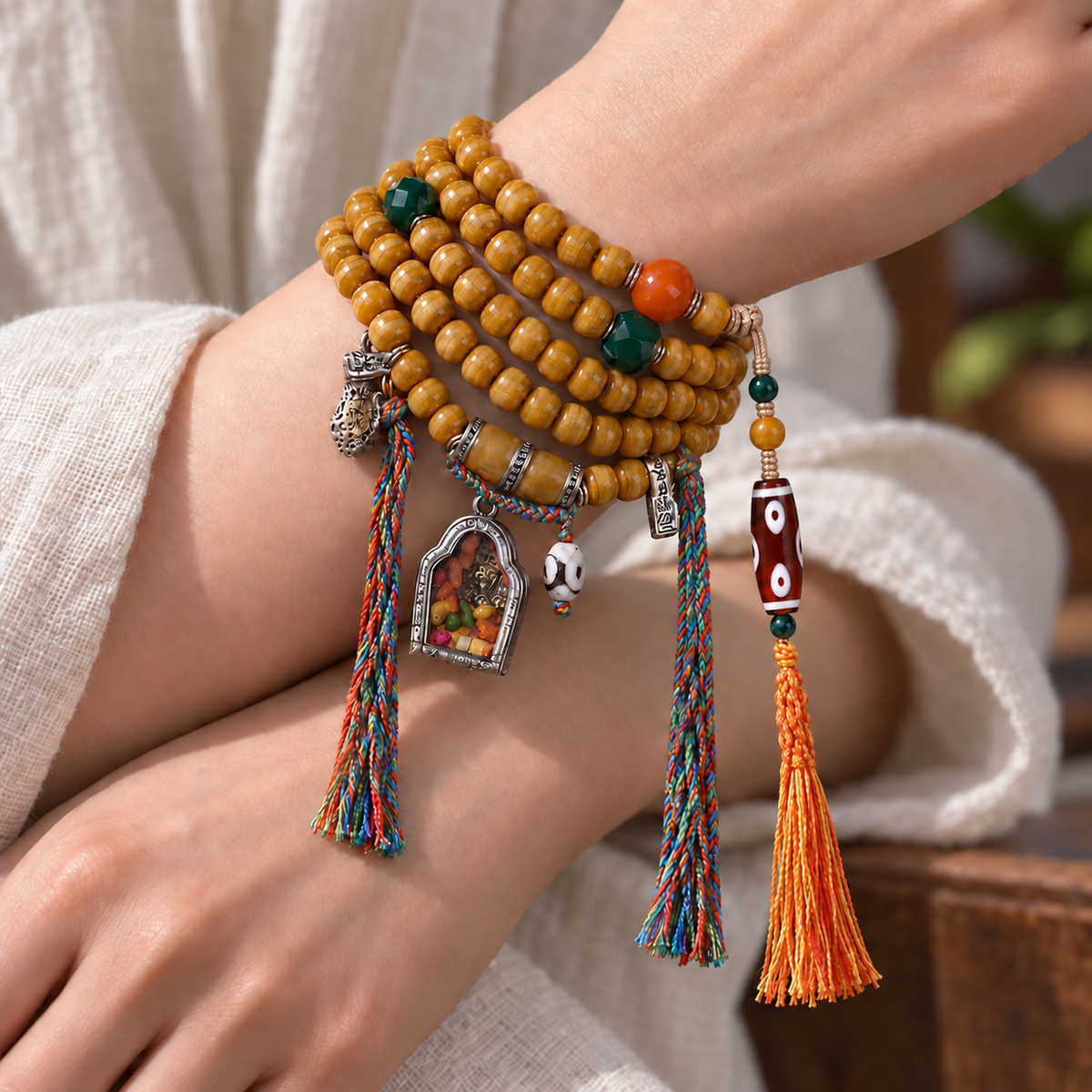 EverestArtstudios Natural Camel Bone 108-Bead Mala with Zaki Lhamo Gau Pendant — wrist crossed