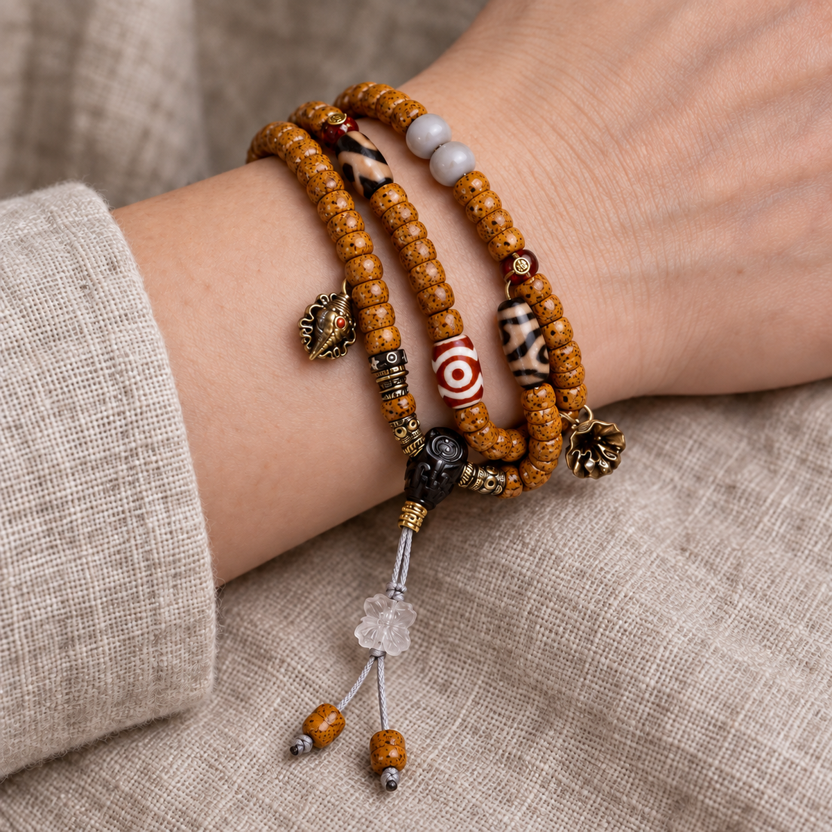 EverestArtstudios Natural Xingyue Bodhi Disc-Bead 108-Bead Mala with Agate and Dzi Accents — wrist resting
