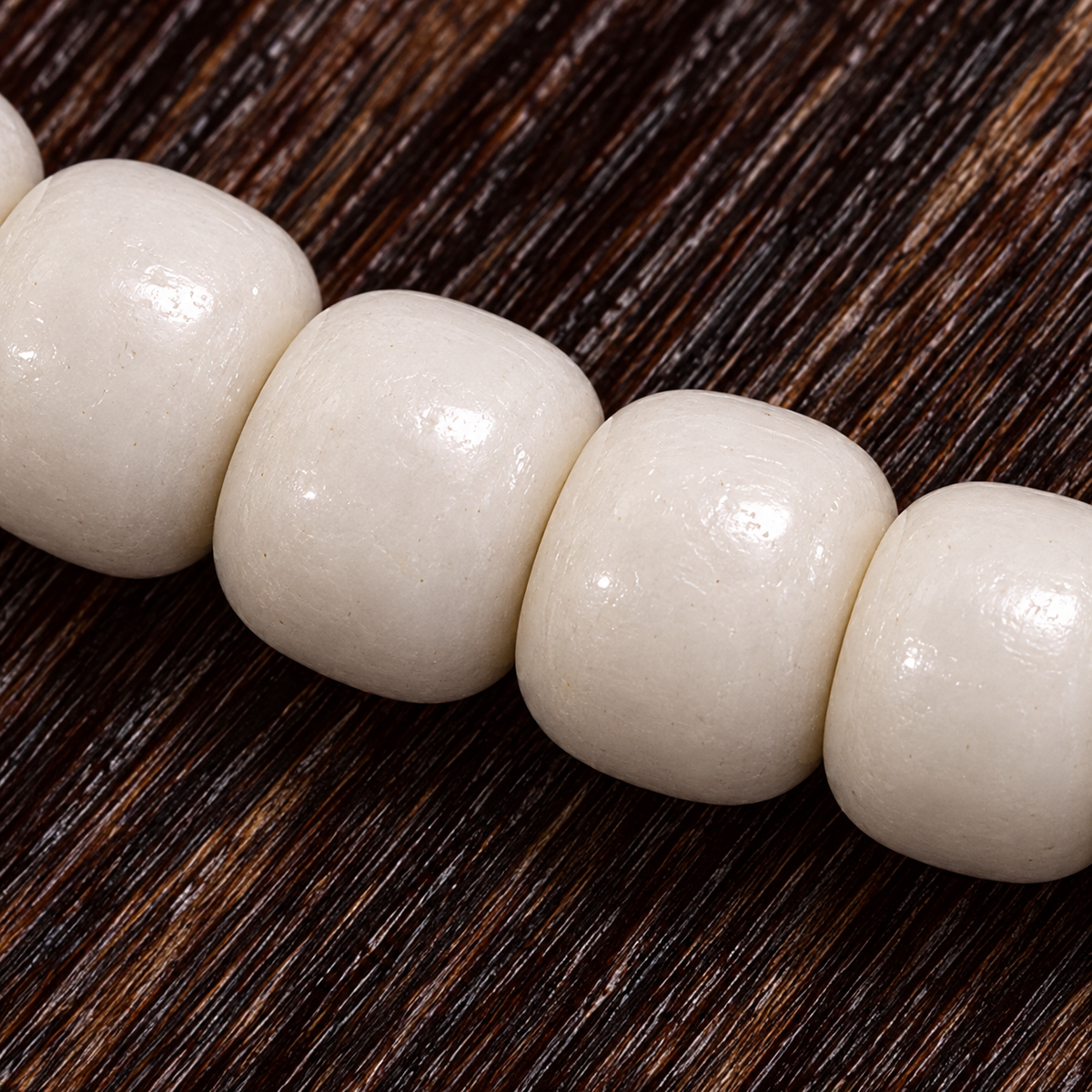 EverestArtstudios Natural Yak Bone 108-Bead Mala with Antler Accents — surface detail