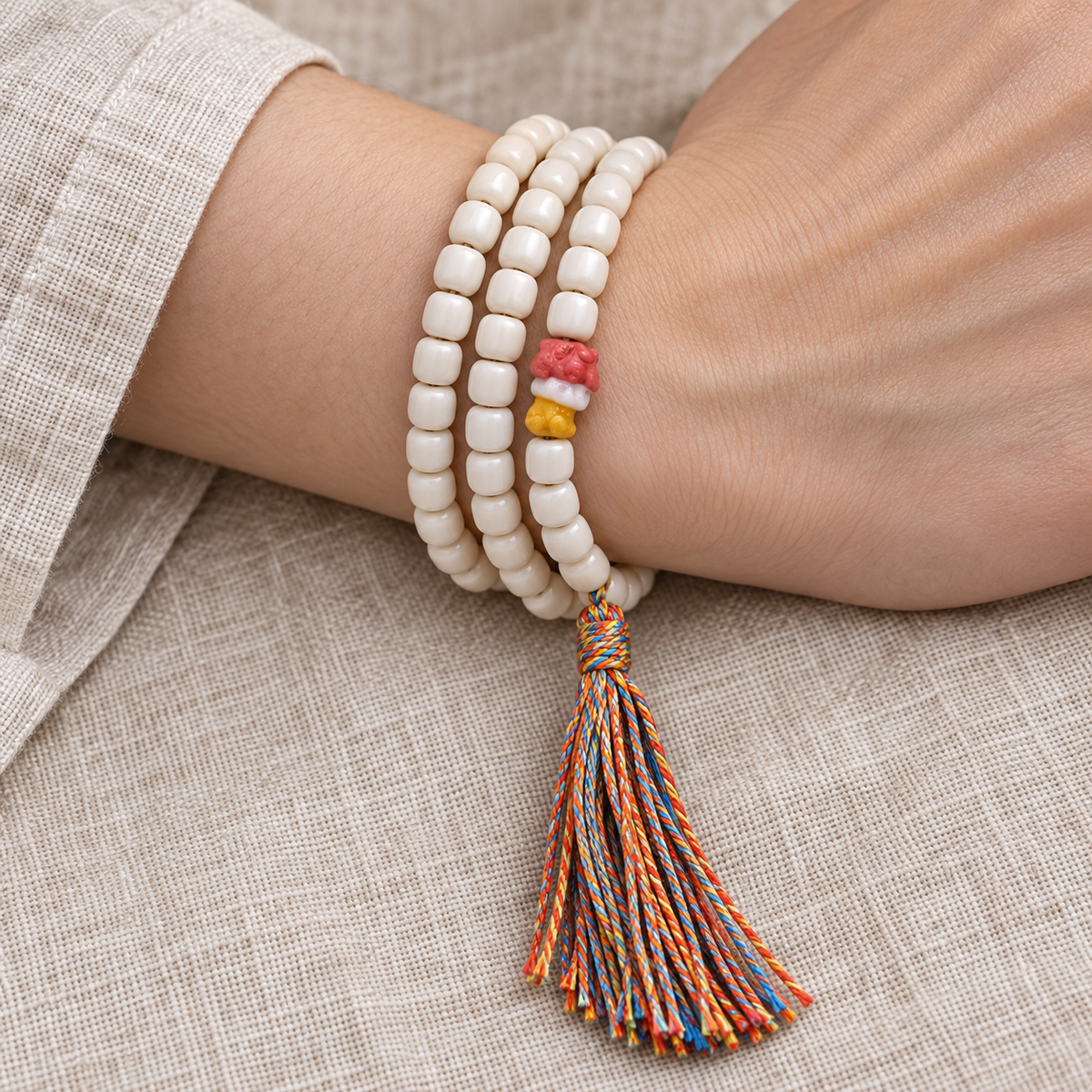 EverestArtstudios Natural Yak Bone 108-Bead Mala with Antler Accents — wrist resting