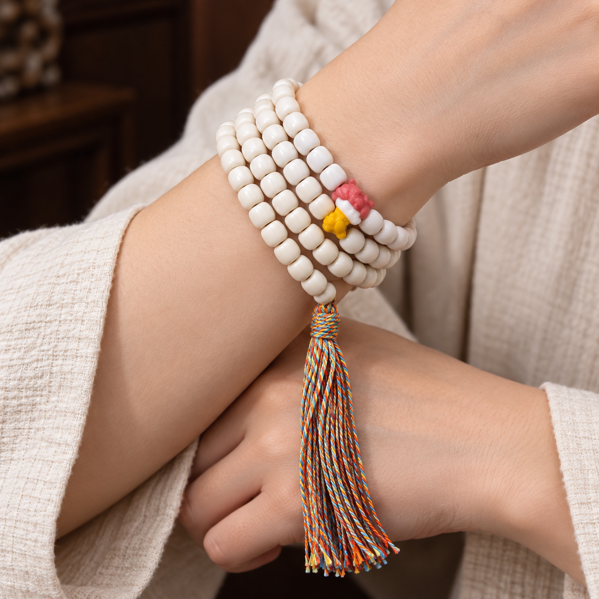 EverestArtstudios Natural Yak Bone 108-Bead Mala with Antler Accents — wrist crossed