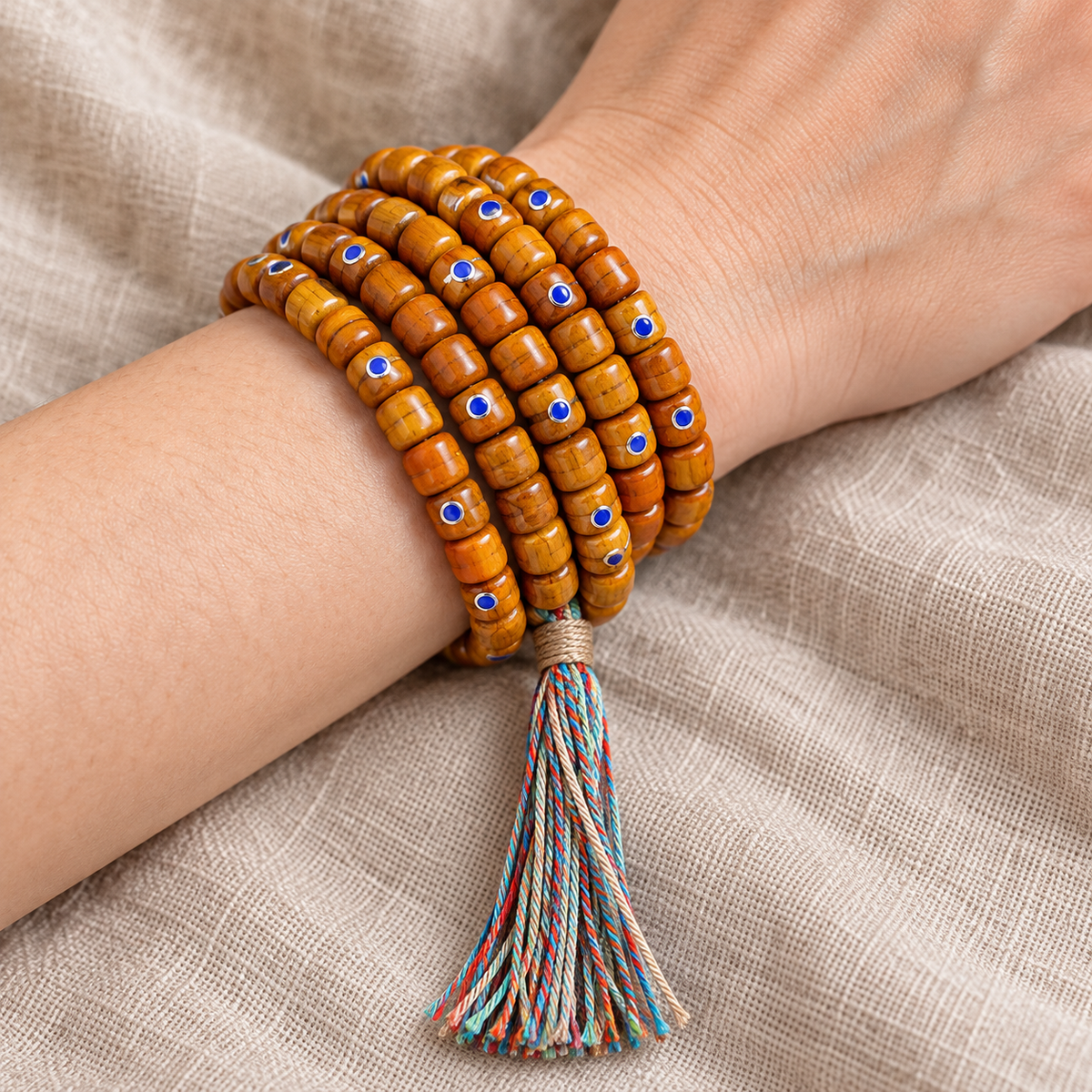 EverestArtstudios Tibetan Vintage Yak Bone Silver-Tone Lapis Inlay 108-Bead Mala — wrist resting