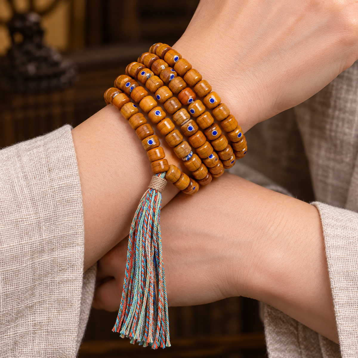 EverestArtstudios Tibetan Vintage Yak Bone Silver-Tone Lapis Inlay 108-Bead Mala — wrist crossed