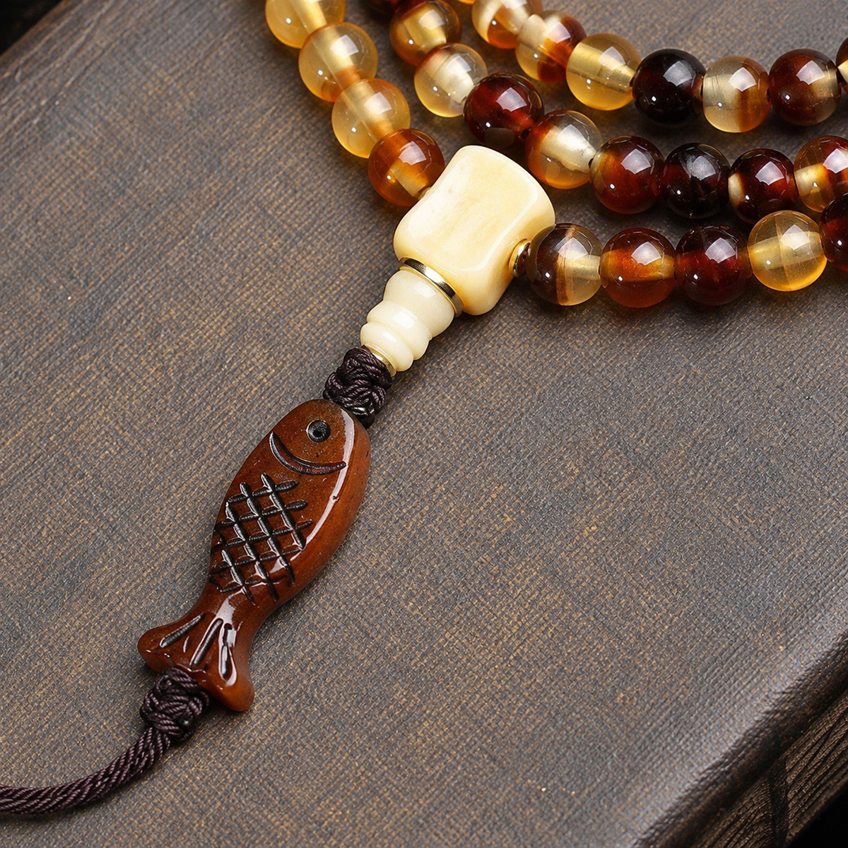 EverestArtstudios Golden Armor 108-Bead Mala with Bone and Dice Accents — connection detail