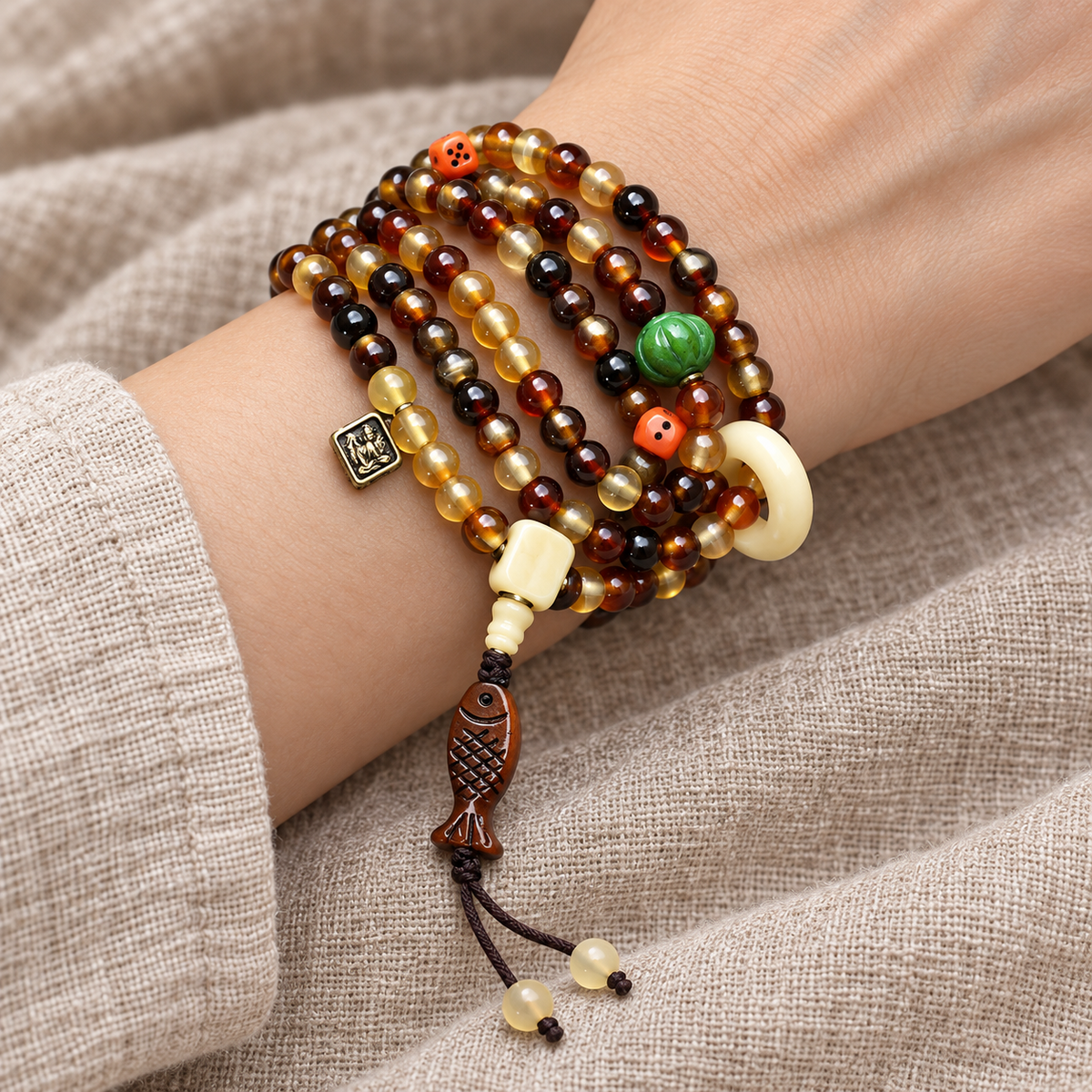 EverestArtstudios Golden Armor 108-Bead Mala with Bone and Dice Accents — wrist resting