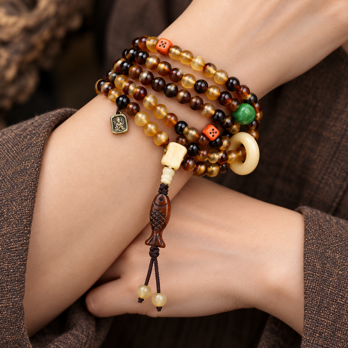 EverestArtstudios Golden Armor 108-Bead Mala with Bone and Dice Accents — wrist crossed