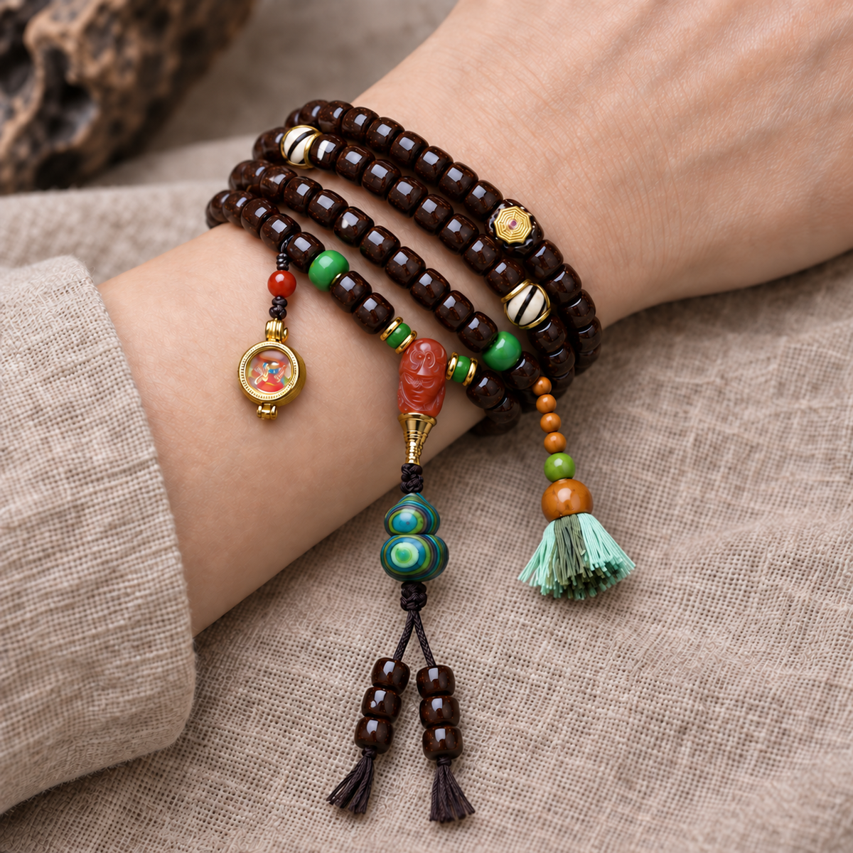 EverestArtstudios Coconut 108-Bead Mala with Dzi-Style Beads and Ghau Pendant — wrist resting