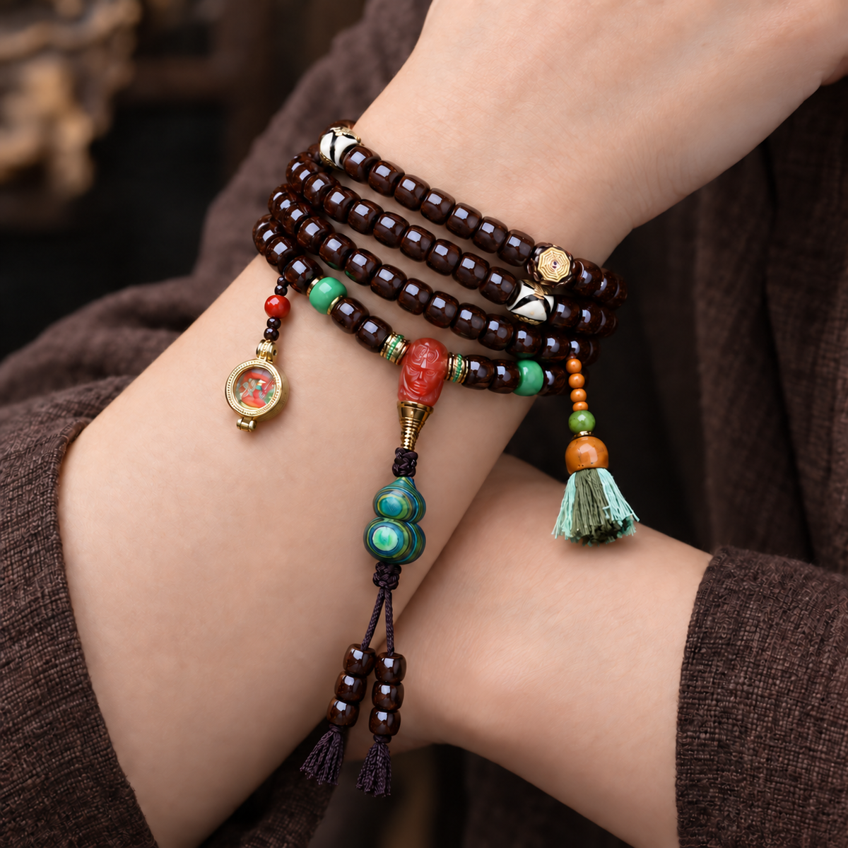 EverestArtstudios Coconut 108-Bead Mala with Dzi-Style Beads and Ghau Pendant — wrist crossed