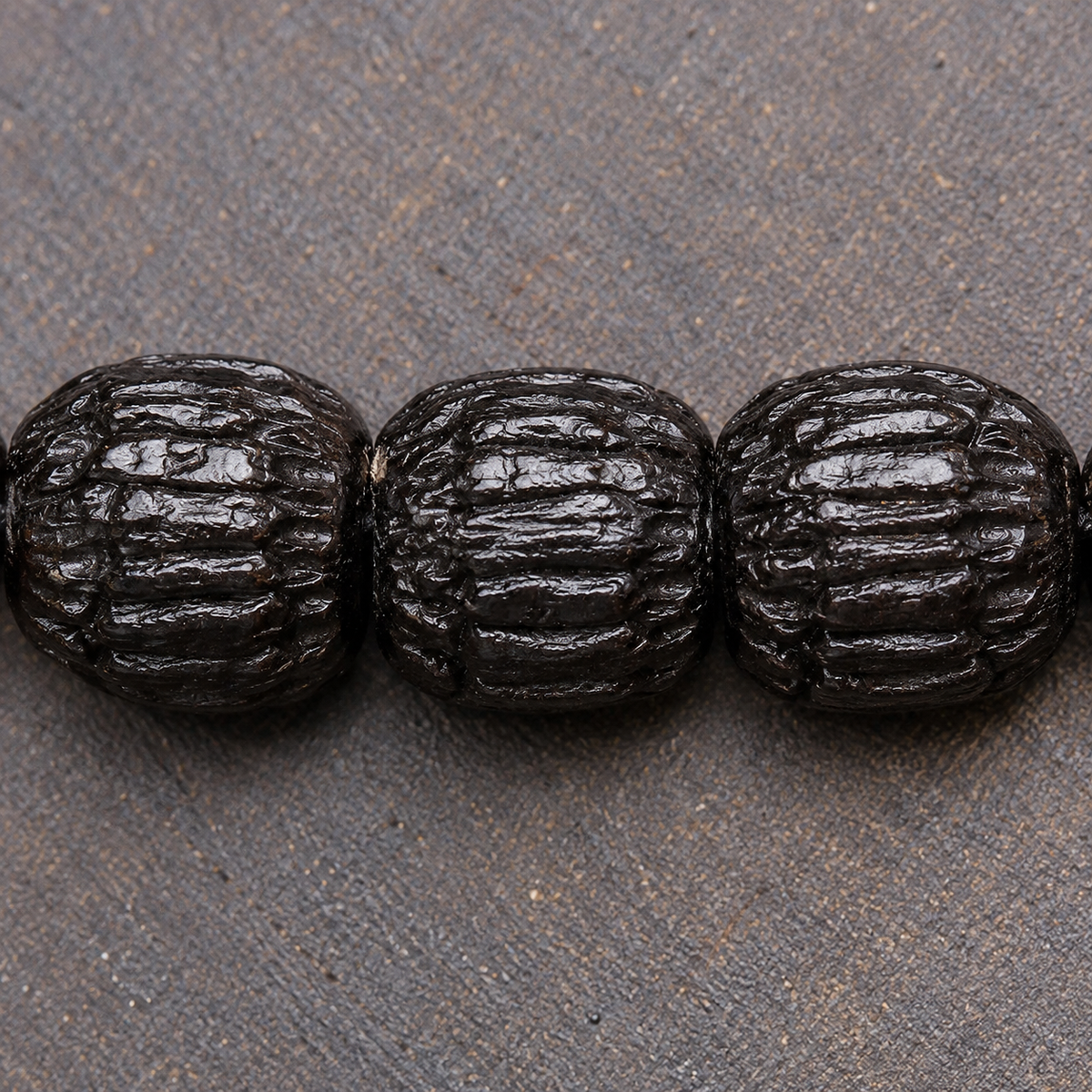 EverestArtstudios Coconut Prayer Beads with Carved Seed and Agate Accents — surface detail