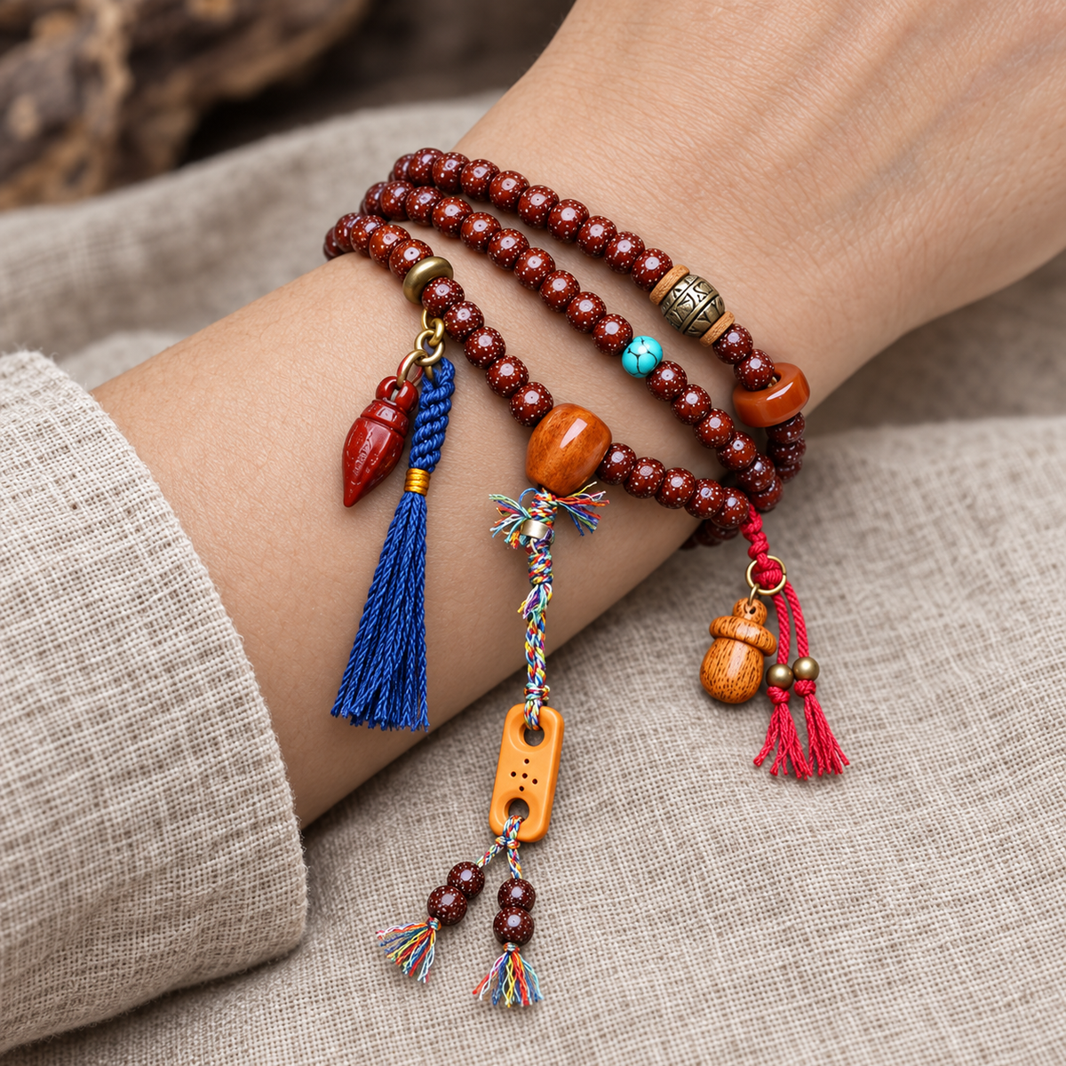 EverestArtstudios Xingyue Bodhi Mala with Turquoise and Carved Accents — wrist resting