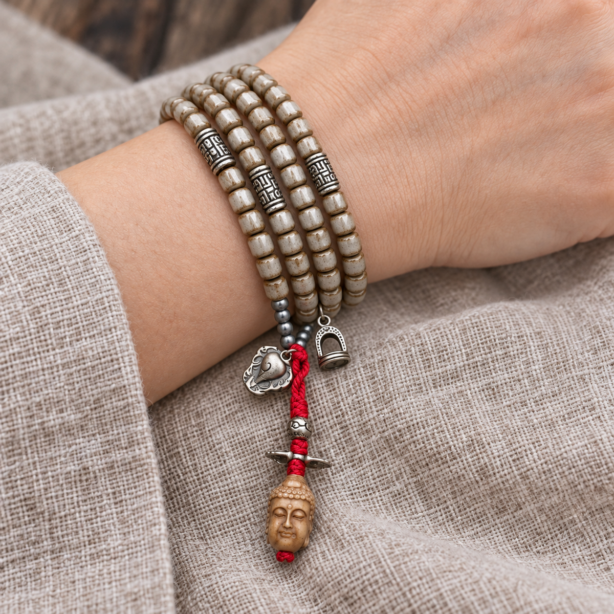 EverestArtstudios Bone 108-Bead Mala with Nine-Eye Motif and Conch Accents — wrist resting