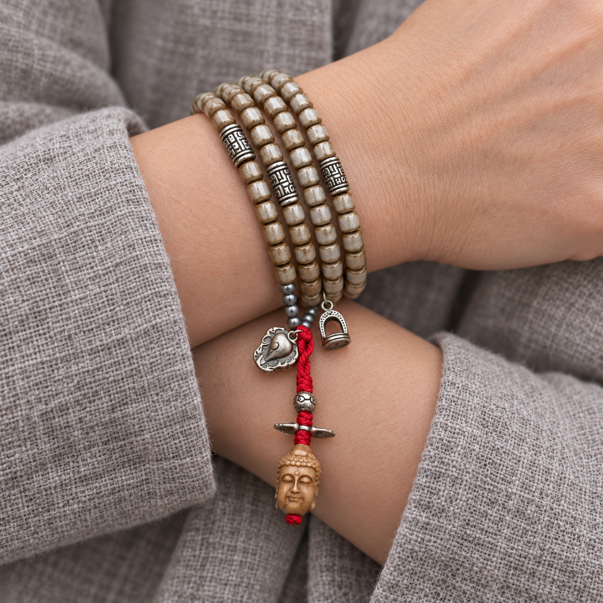 EverestArtstudios Bone 108-Bead Mala with Nine-Eye Motif and Conch Accents — wrist crossed