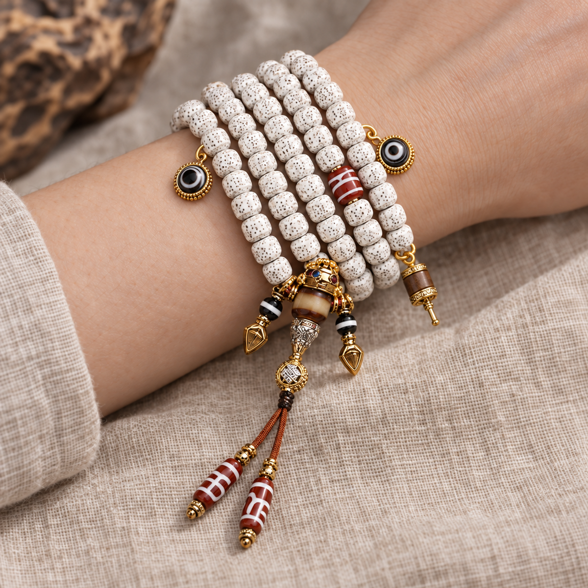 EverestArtstudios Carved Xingyue Bodhi 108-Bead Mala with Dzi-Style Agate Accents — wrist resting