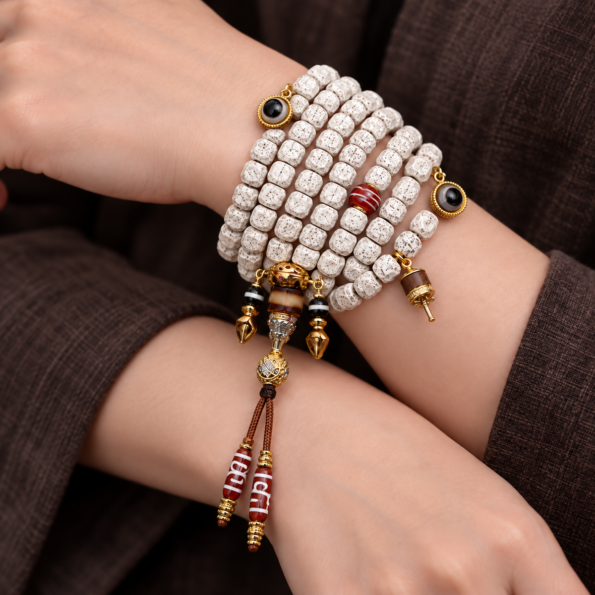 EverestArtstudios Carved Xingyue Bodhi 108-Bead Mala with Dzi-Style Agate Accents — wrist crossed