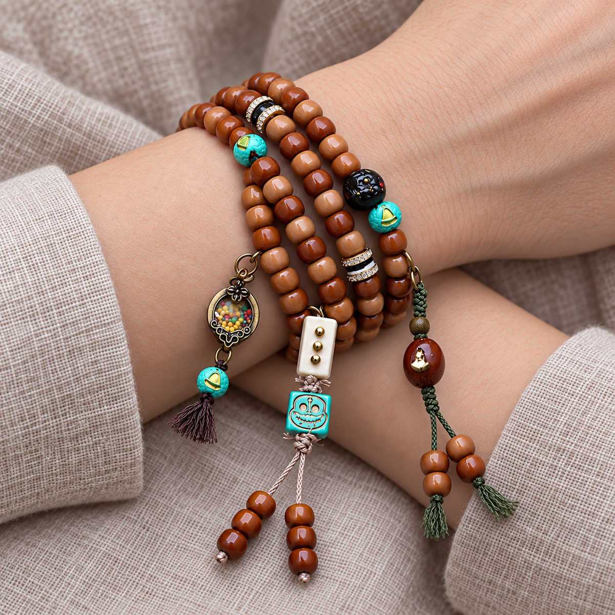 EverestArtstudios 108-Bead Mala with Phoenix Eye Bodhi, Agate and Antler Accents — wrist crossed