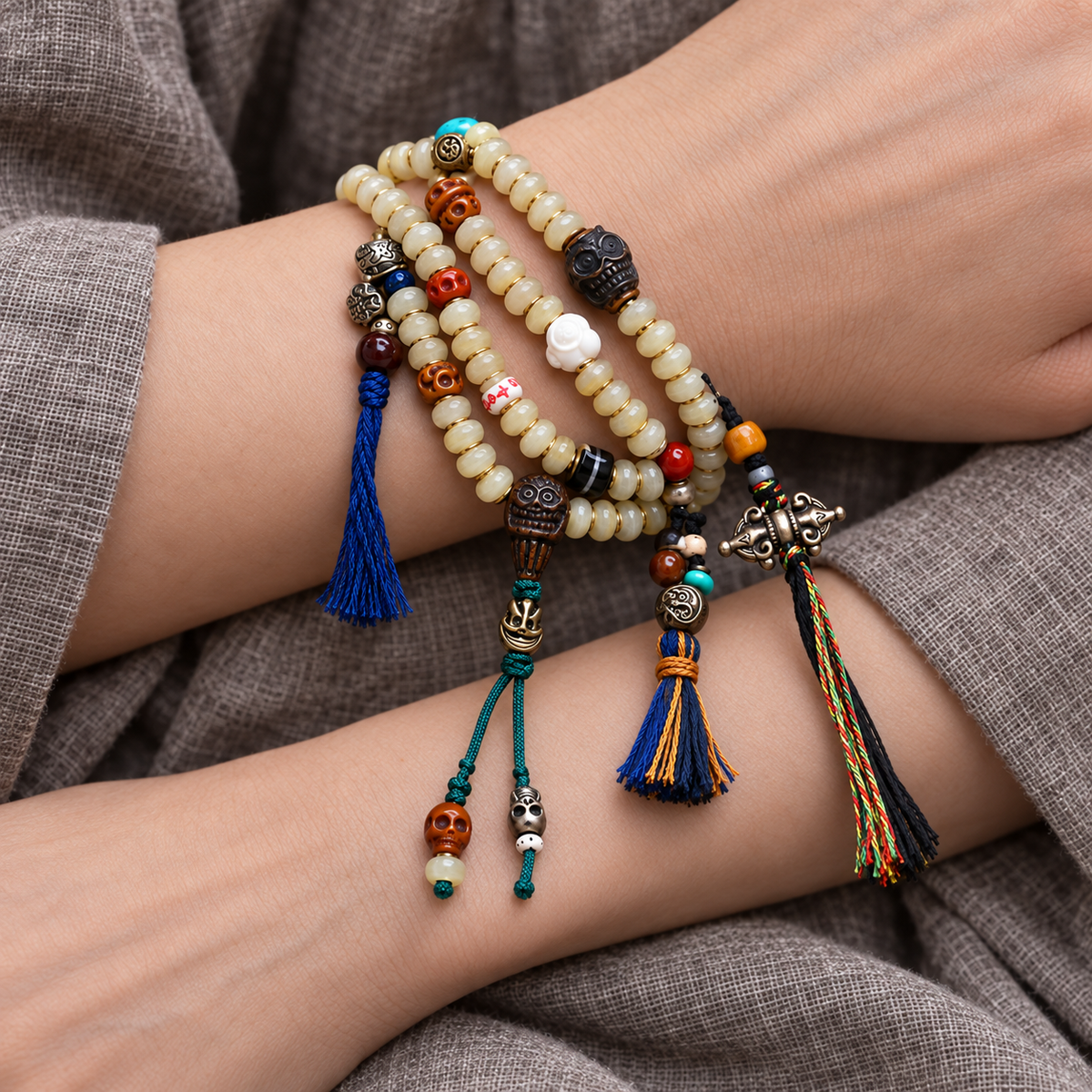 EverestArtstudios Bamboo-Pattern 108-Bead Mala with Carved Charms and Tassels — wrist crossed