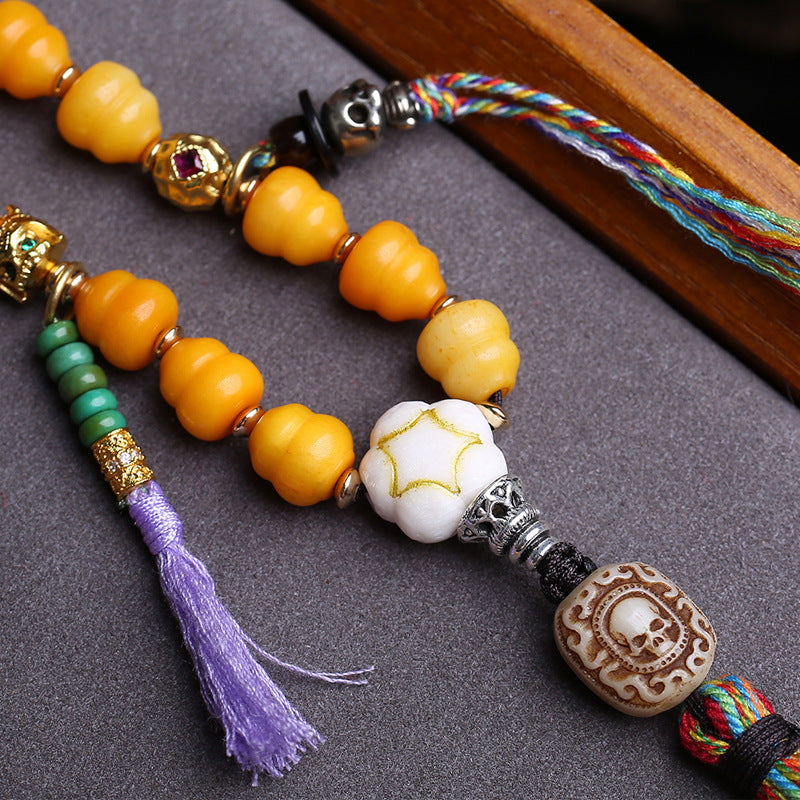 EverestArtstudios Carved Bone Mala with Gourd and Dzi-Style Agate Accents — connection detail