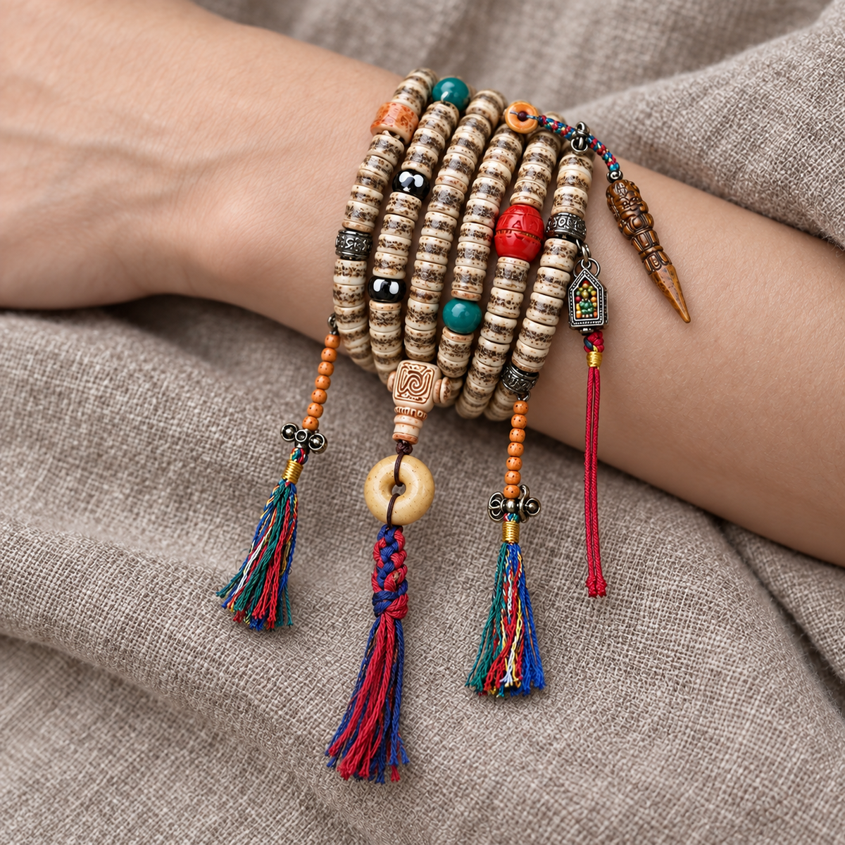 EverestArtstudios 108-Bead Mala with Camel Bone and Ghau Pendant — wrist resting