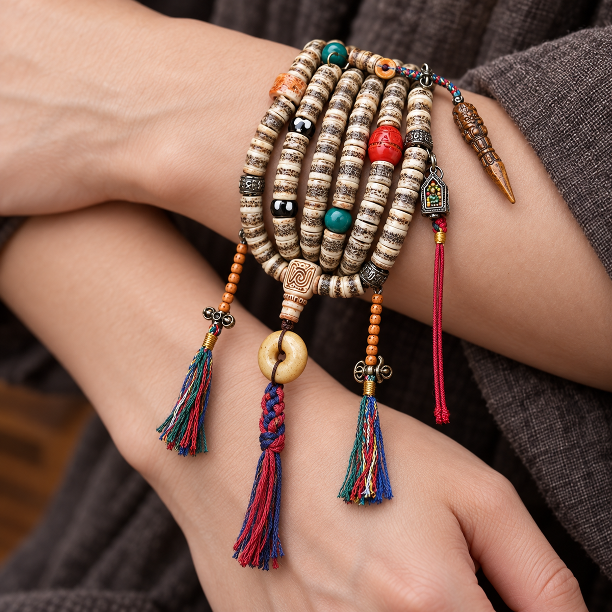 EverestArtstudios 108-Bead Mala with Camel Bone and Ghau Pendant — wrist crossed
