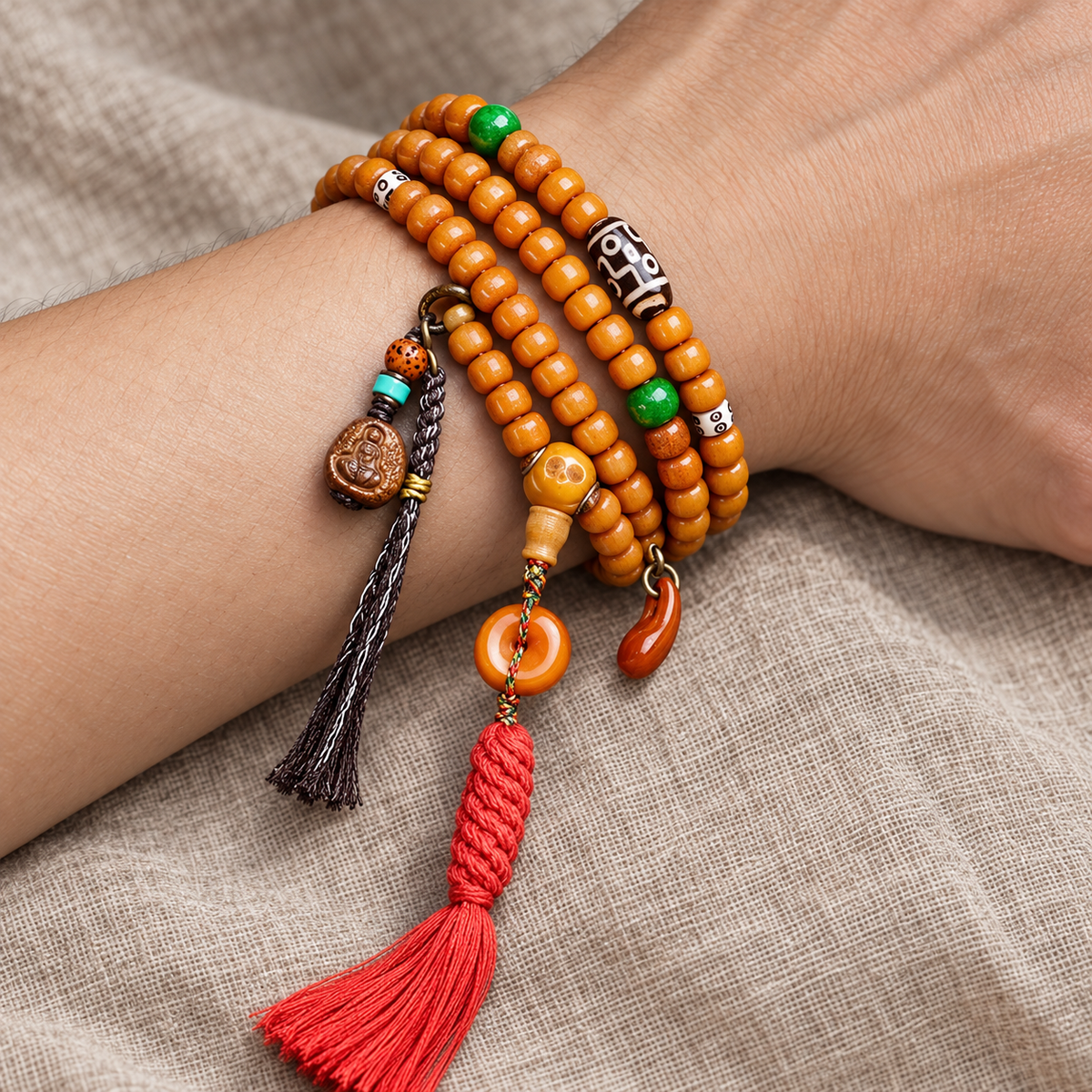 EverestArtstudios Yak Bone 108-Bead Mala in Four Decorative Styles — wrist resting