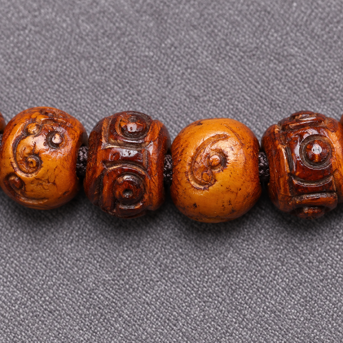 EverestArtstudios Carved Camel Bone 108-Bead Mala with Yak Bone and Agate Accents — surface detail