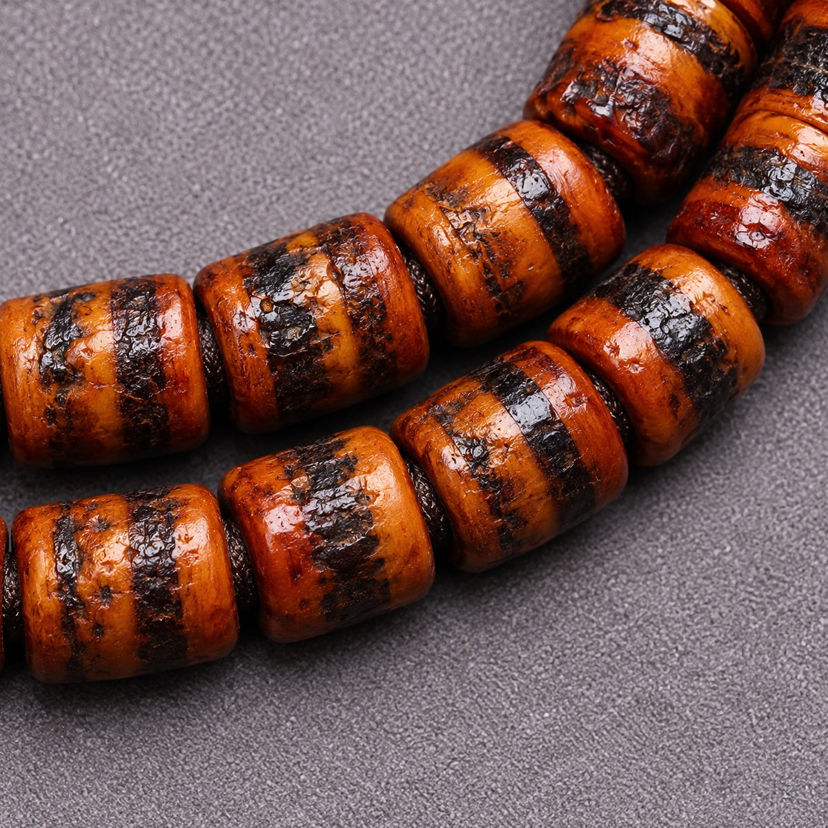 EverestArtstudios Yak Bone 108-Bead Mala with Wealth Deity and Mantra Motifs — bead detail
