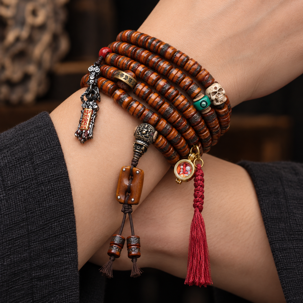 EverestArtstudios Yak Bone 108-Bead Mala with Wealth Deity and Mantra Motifs — wrist crossed