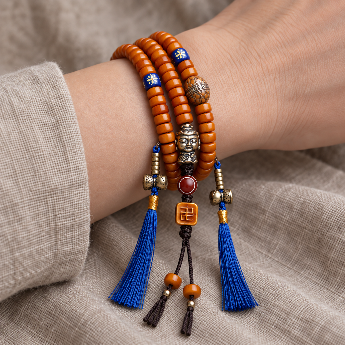 EverestArtstudios Yak Bone 108-Bead Mala with Lotus and Vajra Bodhi Accents — wrist resting