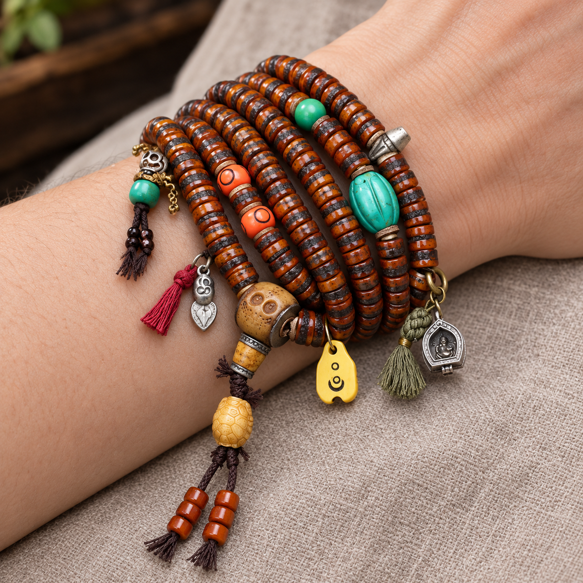 EverestArtstudios Yak Bone 108-Bead Mala with Ghau Pendant and Hanging Charm — wrist resting
