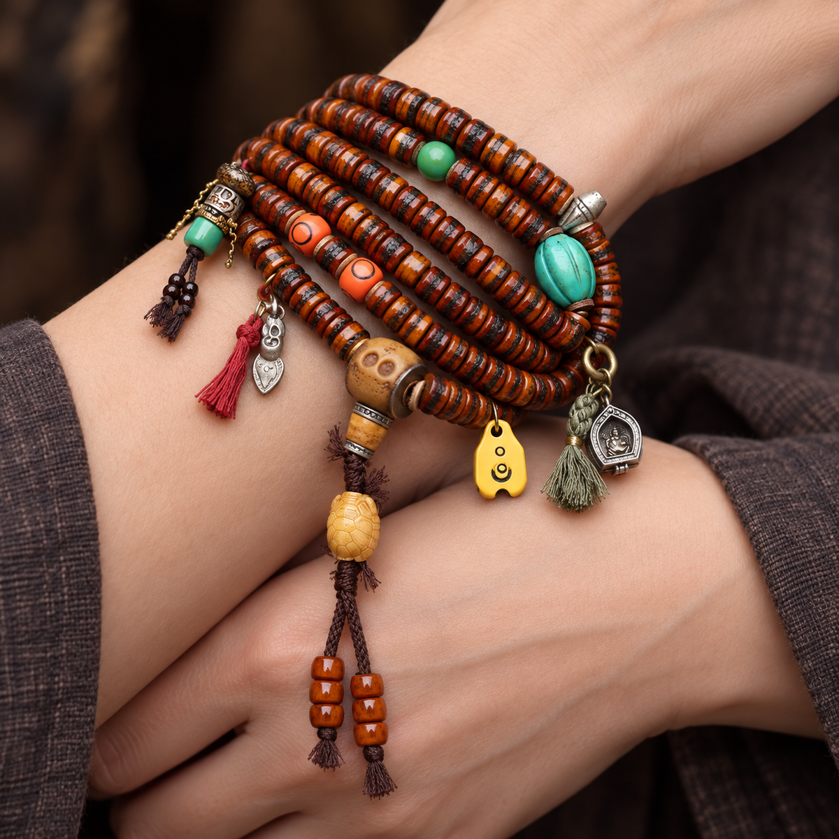 EverestArtstudios Yak Bone 108-Bead Mala with Ghau Pendant and Hanging Charm — wrist crossed