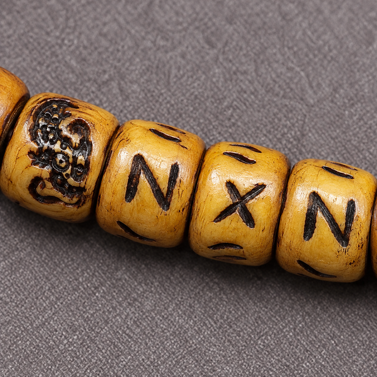 EverestArtstudios Carved Yak Bone 108-Bead Mala with Camel Bone, Glass and Agate Accents — surface detail